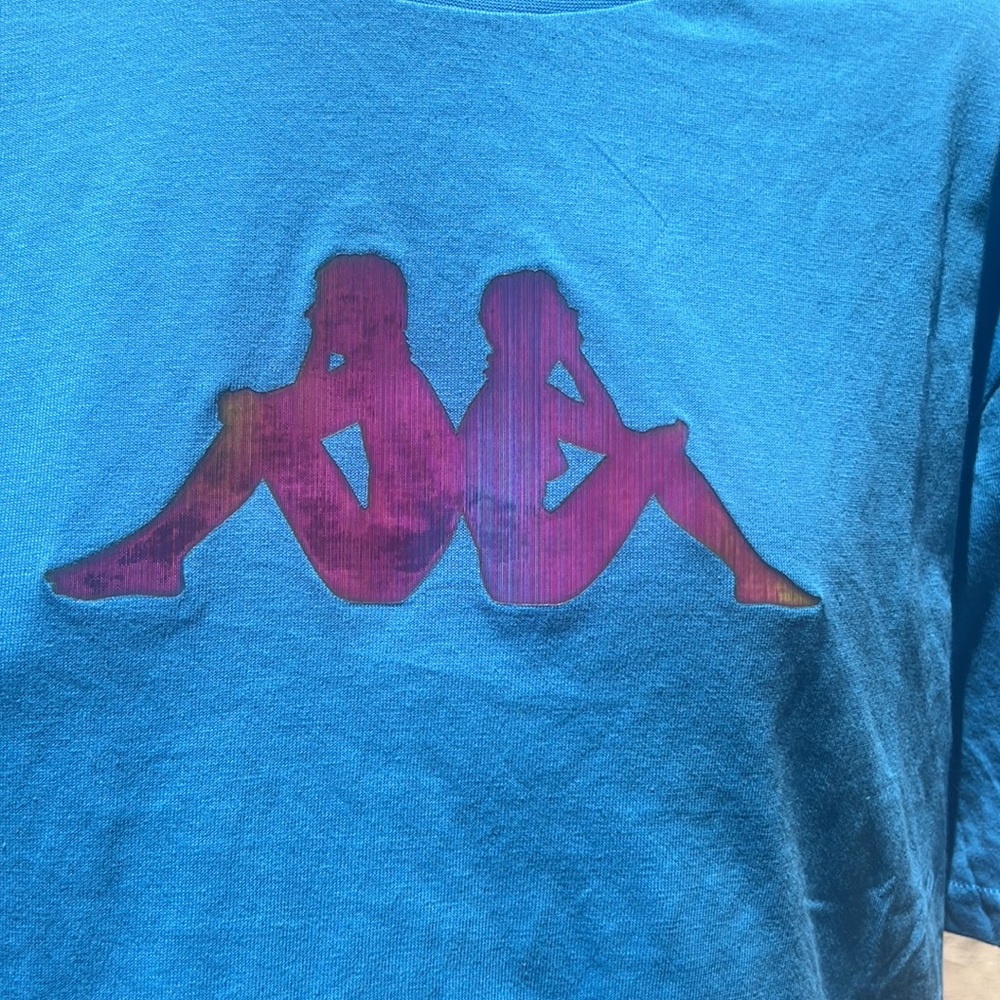 Kappa NWOT Hologram XL t-shirt.Cotton with logo tape on the shoulders light blue